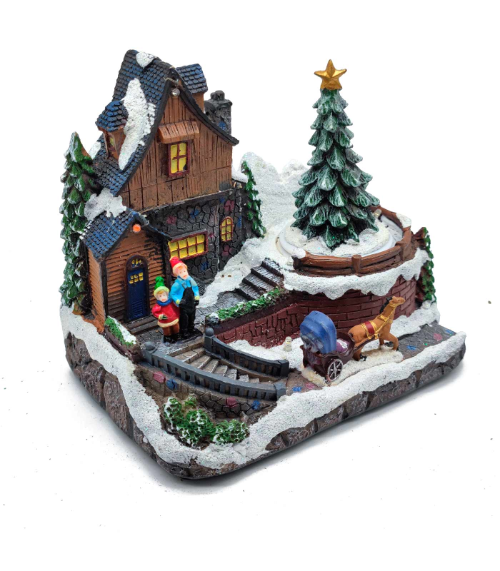 Tradineur - Casa navideña decorativa con luces LED - Fabricado en resina - casita de navidad nevada con figuras a pilas - 15 x 17,5 x 11 cm